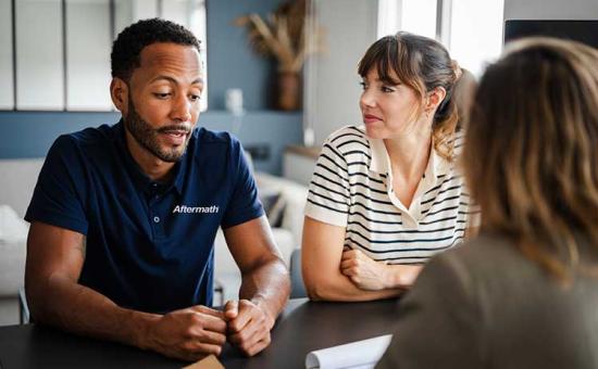 Aftermath employee with client