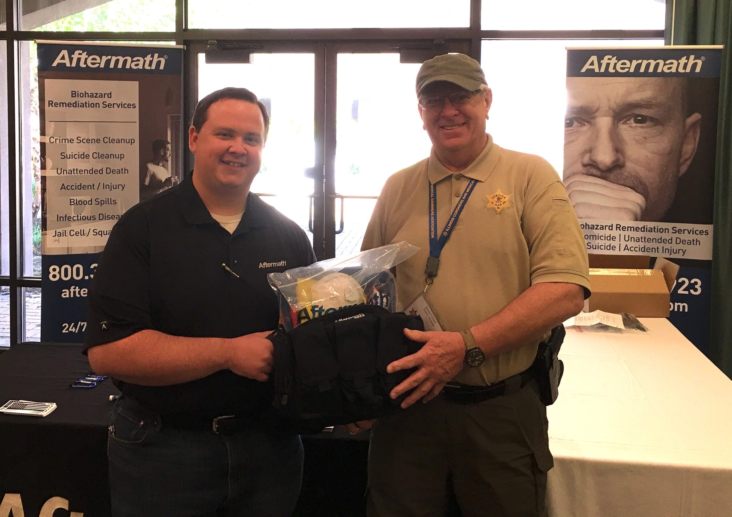 Aftermath awards Dennis Nichols a PPE kit and Tactical Bag at the 2018 ICMEA Conference