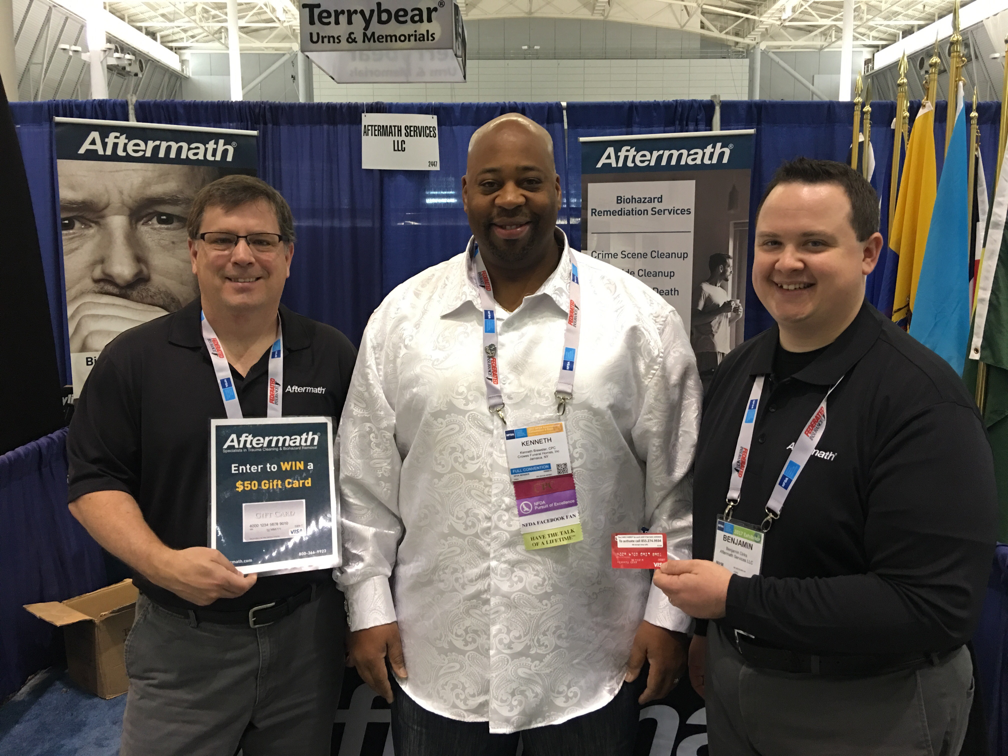 National Funeral Directors Assoc. Conference winner of Aftermath giveaway standing with Ben from Aftermath.