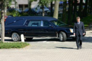 Black hearse at a funeral.