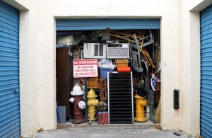 Full Overflowing Storage Unit Bursting with Heap of Junk